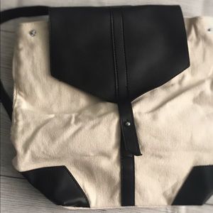 Black and canvas cream purse back pack